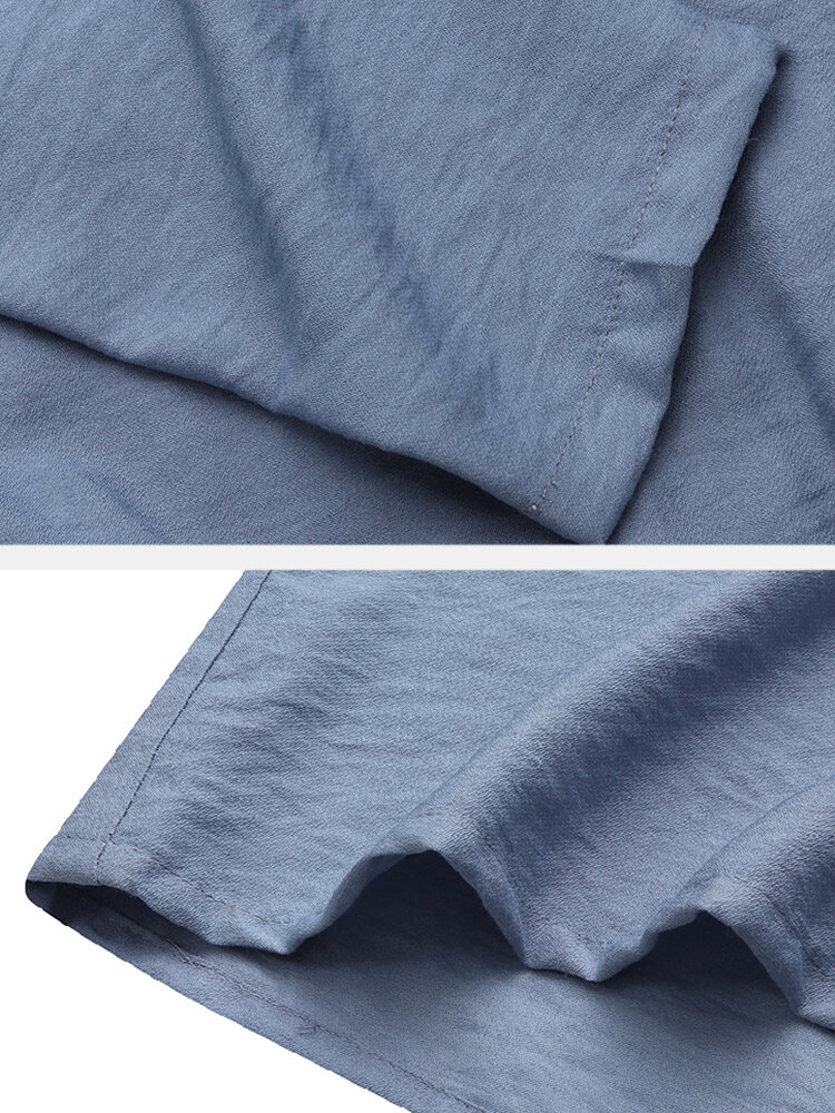 
	Ethnic Solid Color Pocket Button Long Sleeve Lapel Maxi Dress